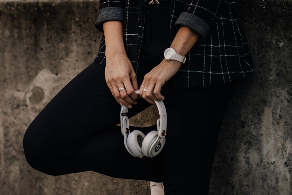Tampa Wedding DJ Kira Lira holding a pair of headphones