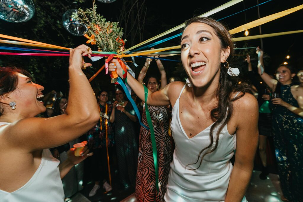 Bride holds bouquet on the dance floor