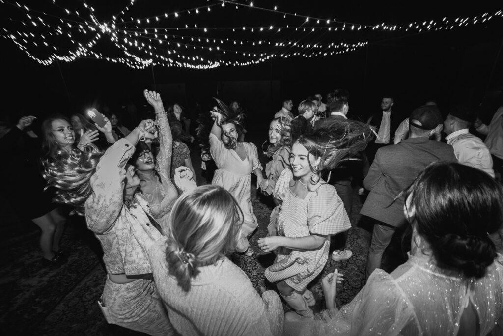 Bridesmaids dancing on an energetic dancefloor